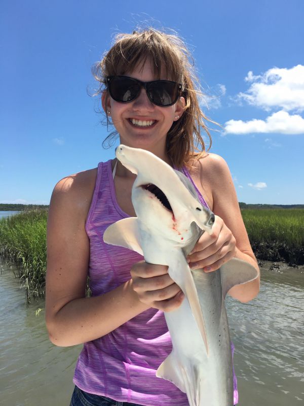 Woman Holding Very Small Fish On End Of Fishing Line With Disappointed  Expression by Stocksy Contributor Matthew Spaulding - Stocksy